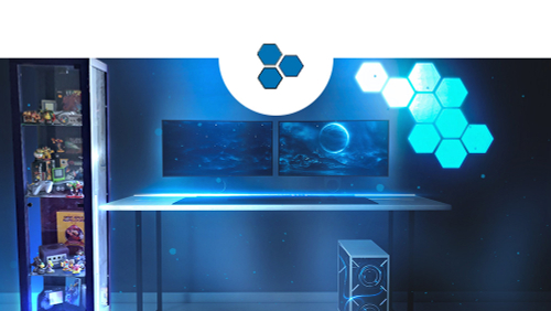 A gaming room consisting of a desk, monitor, PC, decoration and display case complete with collectibles.