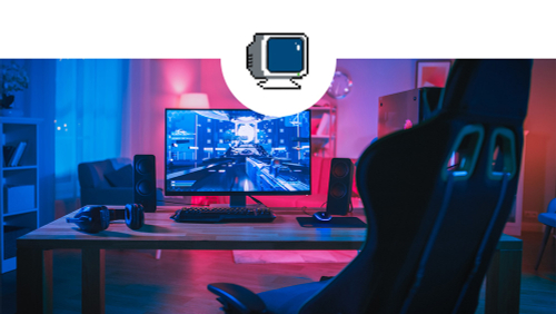 A gaming room complete with desk, chair and monitor.
